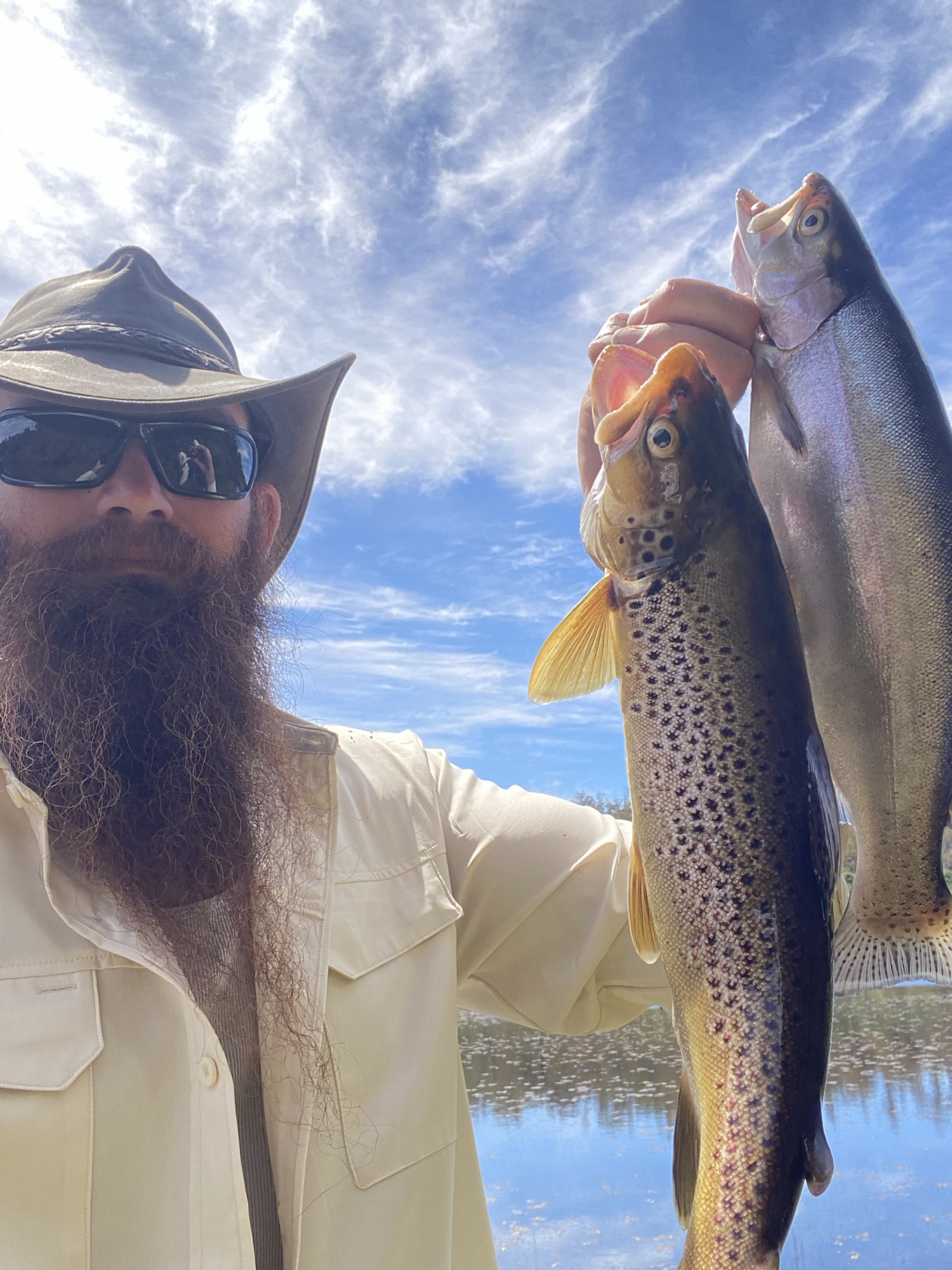 Phillip Bigg with brown and rainbow trout